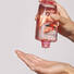 kerastase genesis bain hydra fortifiant shampoo product in hand