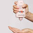 kerastase genesis bain nutri fortifiant shampoo product in hand
